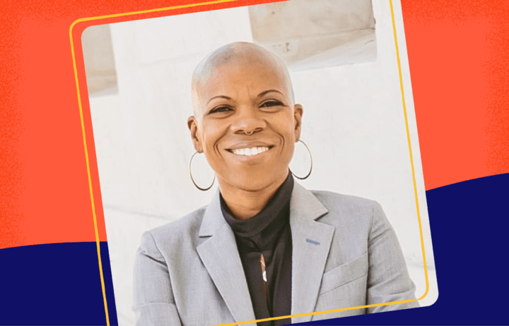 Picture of Jaymes Black posing with Grey Jacket with a blurred background.